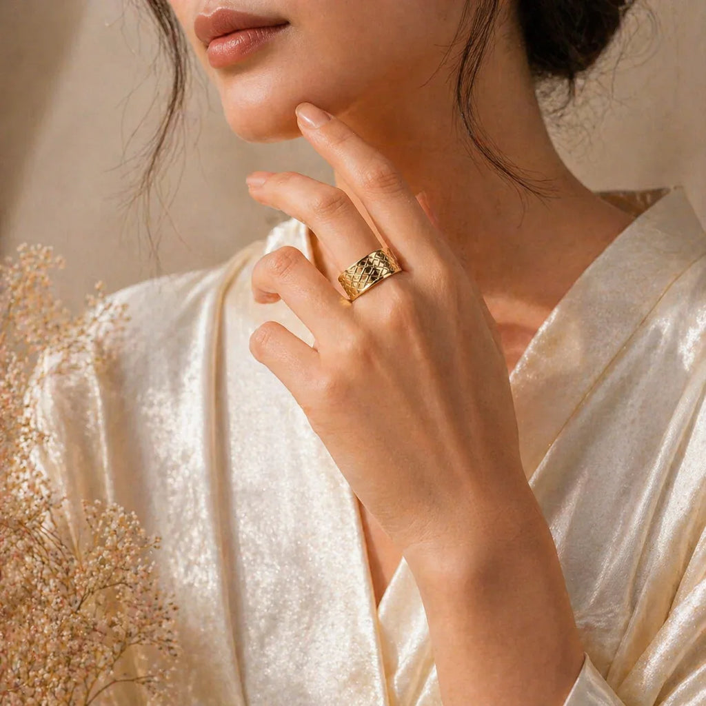 Gold textured ring on woman's hand, elegant everyday luxury jewelry for women