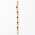 Elegant gold bracelet with black oval stones and clear crystals, anti-tarnish luxury jewelry for women