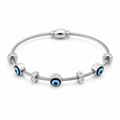 Silver cable bracelet with blue evil eye charms and crystal accents, anti-tarnish women's jewelry