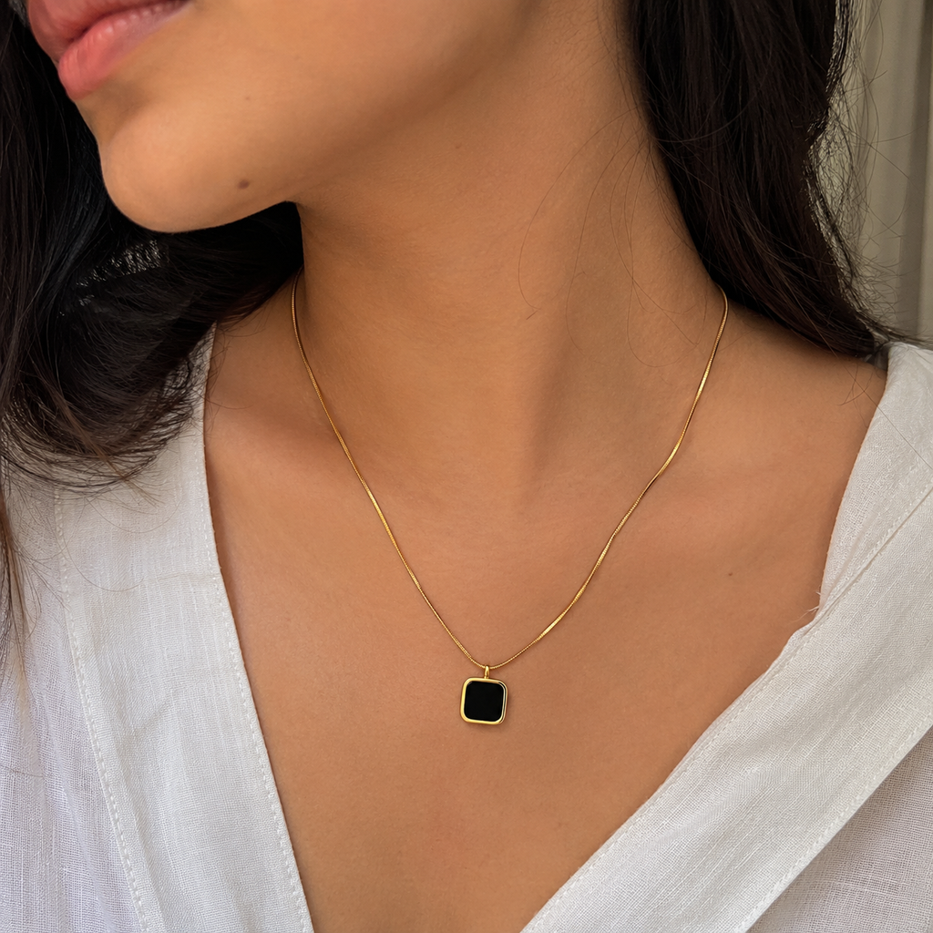Gold square pendant necklace with black stone, elegant everyday luxury jewelry for women