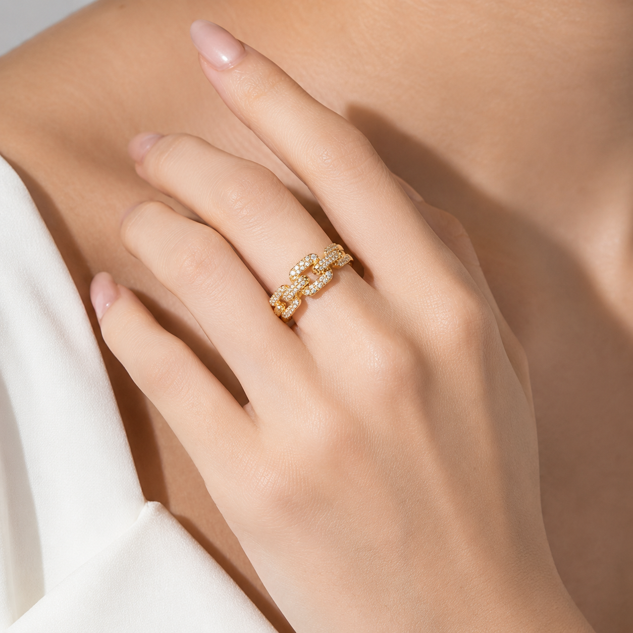 Gold chain-link ring with sparkling stones, elegant everyday luxury jewelry for women
