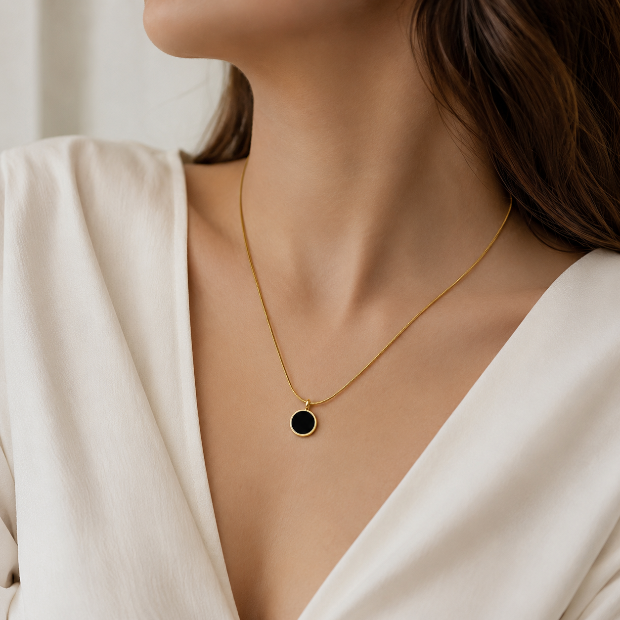 Gold chain necklace with black circular pendant, elegant everyday luxury jewelry for women