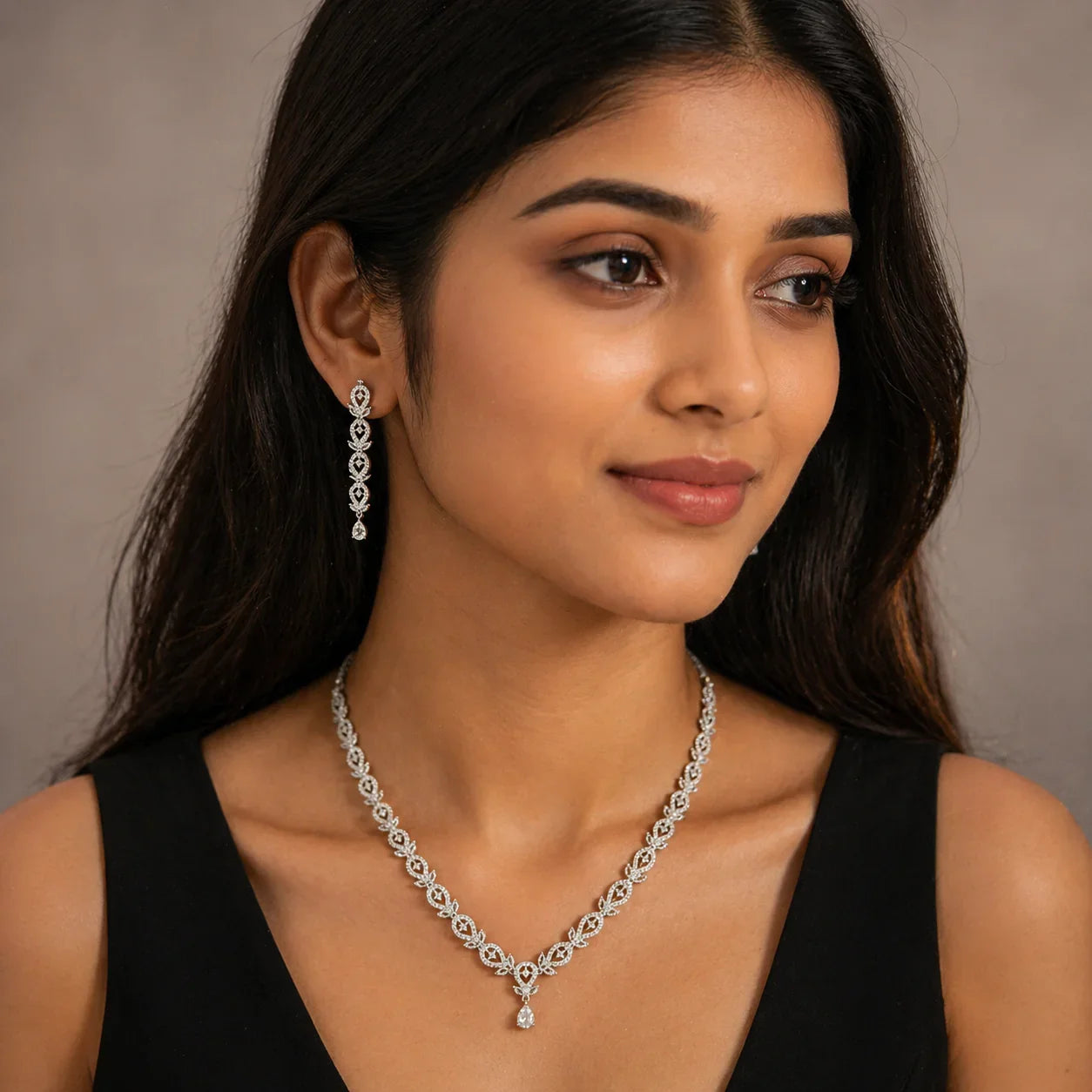 Elegant diamond necklace and matching drop earrings for women, perfect for everyday luxury and special occasions.