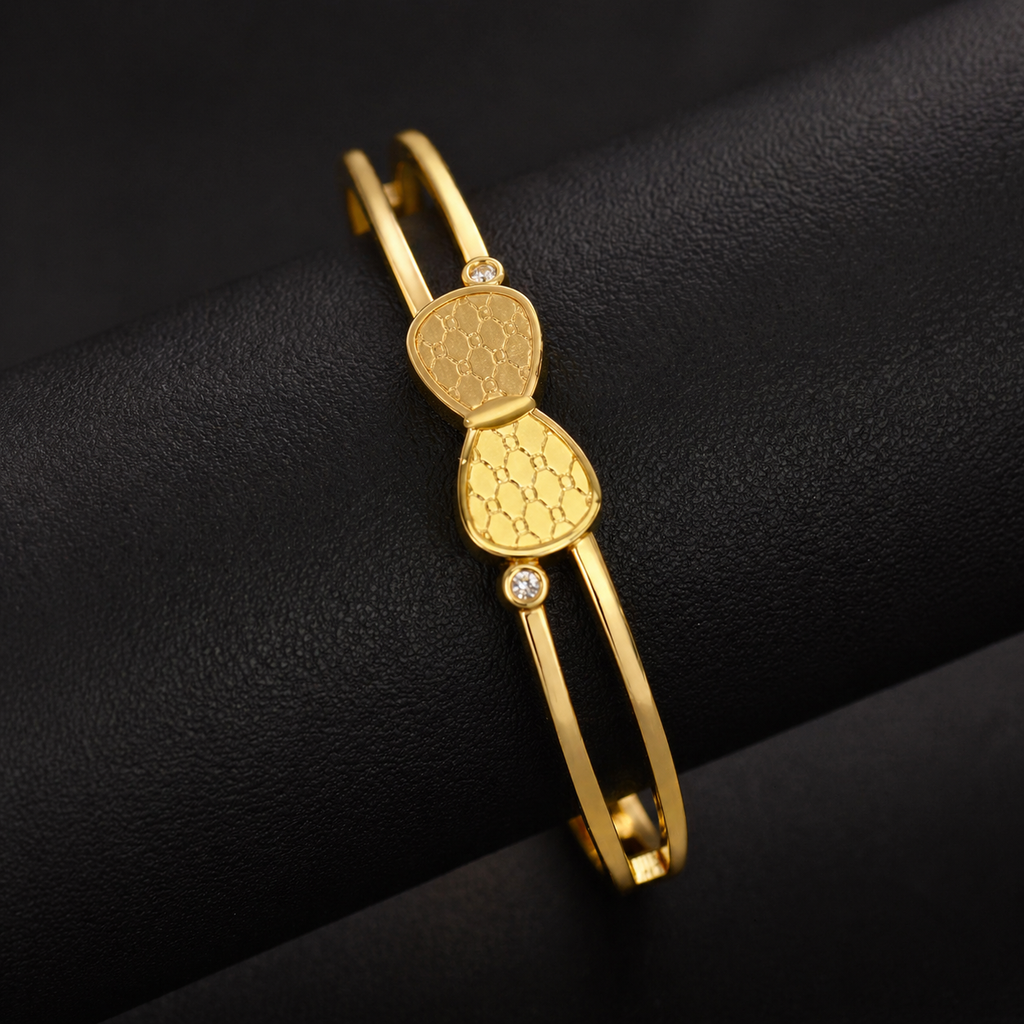 Gold anti-tarnish bangle with textured teardrop design and crystal accents, elegant women's jewelry