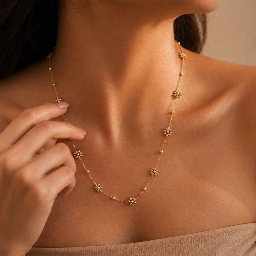 Delicate gold flower necklace with sparkling stones, elegant everyday luxury jewelry for women