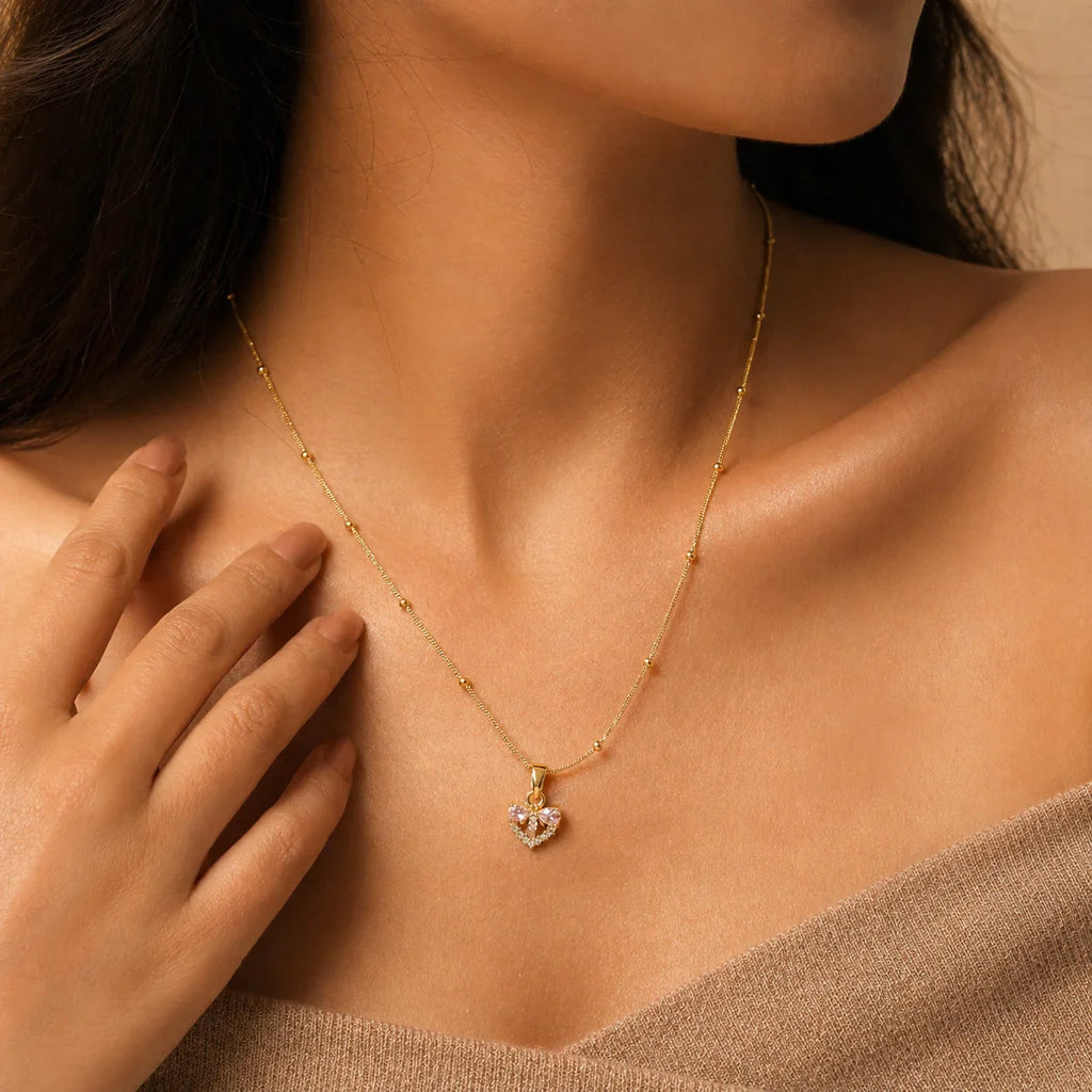 Gold heart pendant necklace with pink gemstones, delicate chain, anti-tarnish jewelry for women
