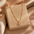 Gold heart pendant necklace with pink crystals, anti-tarnish jewelry for women, elegant everyday luxury