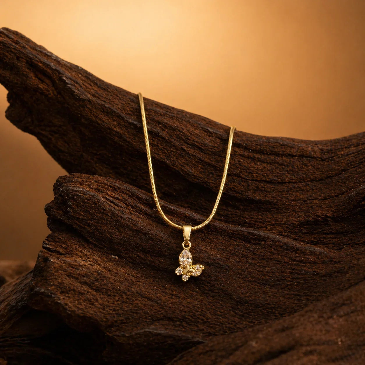 Gold butterfly pendant necklace with sparkling stones, elegant everyday luxury jewelry for women