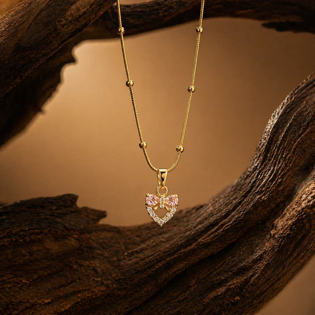 Gold heart pendant necklace with pink bow & crystals, anti-tarnish jewelry for women
