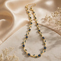 Elegant gold necklace with blue gemstones on silk, perfect for everyday luxury jewelry for women