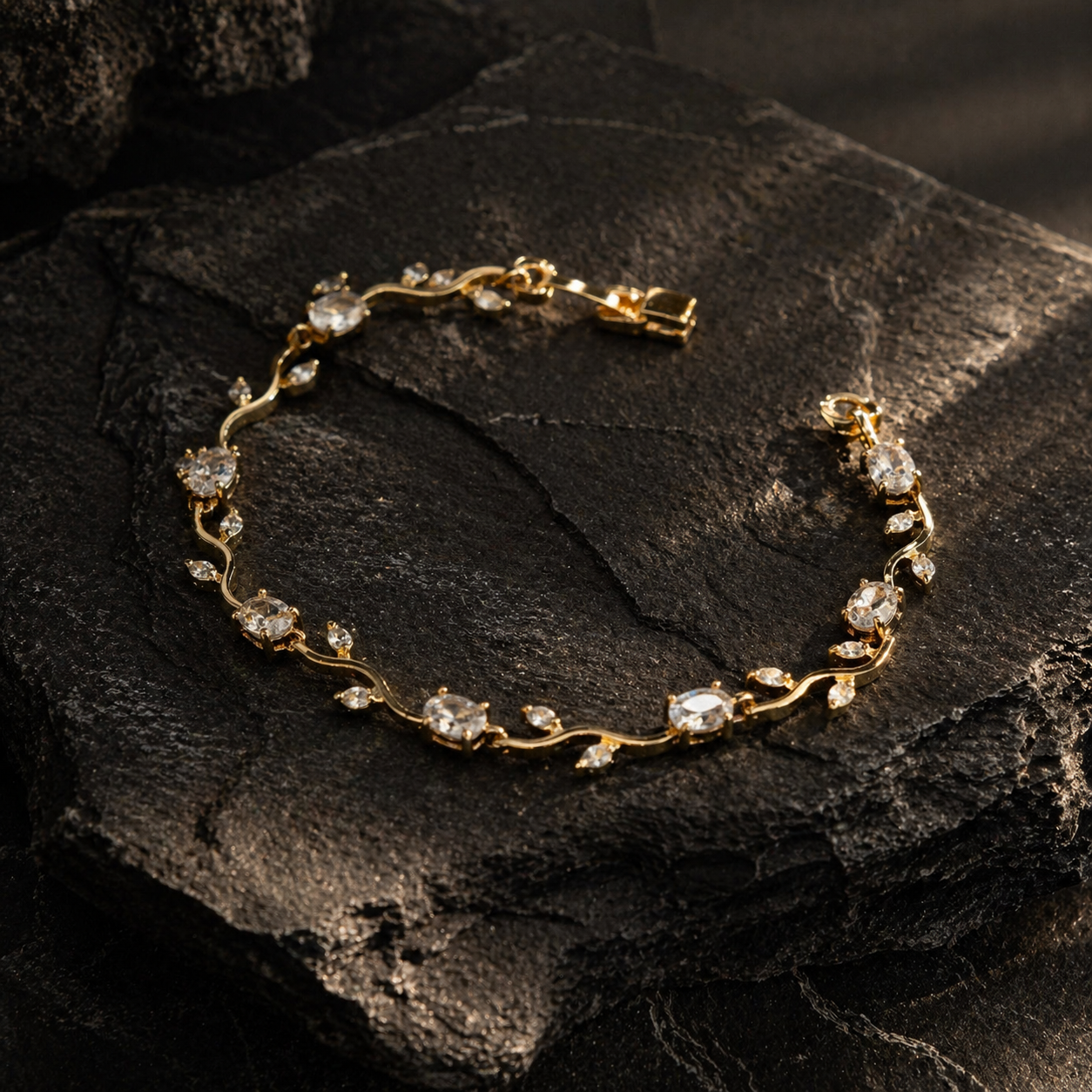 Elegant gold bracelet with clear gemstones on dark stone, anti-tarnish luxury jewelry for women