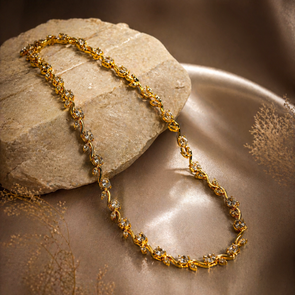 Elegant gold necklace with sparkling stones, displayed on stone and satin for luxury women's jewelry
