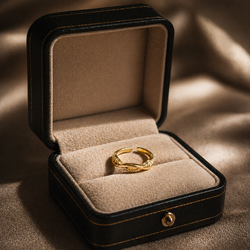 Elegant gold ring with diamond accents in black velvet box, anti-tarnish luxury jewelry for women