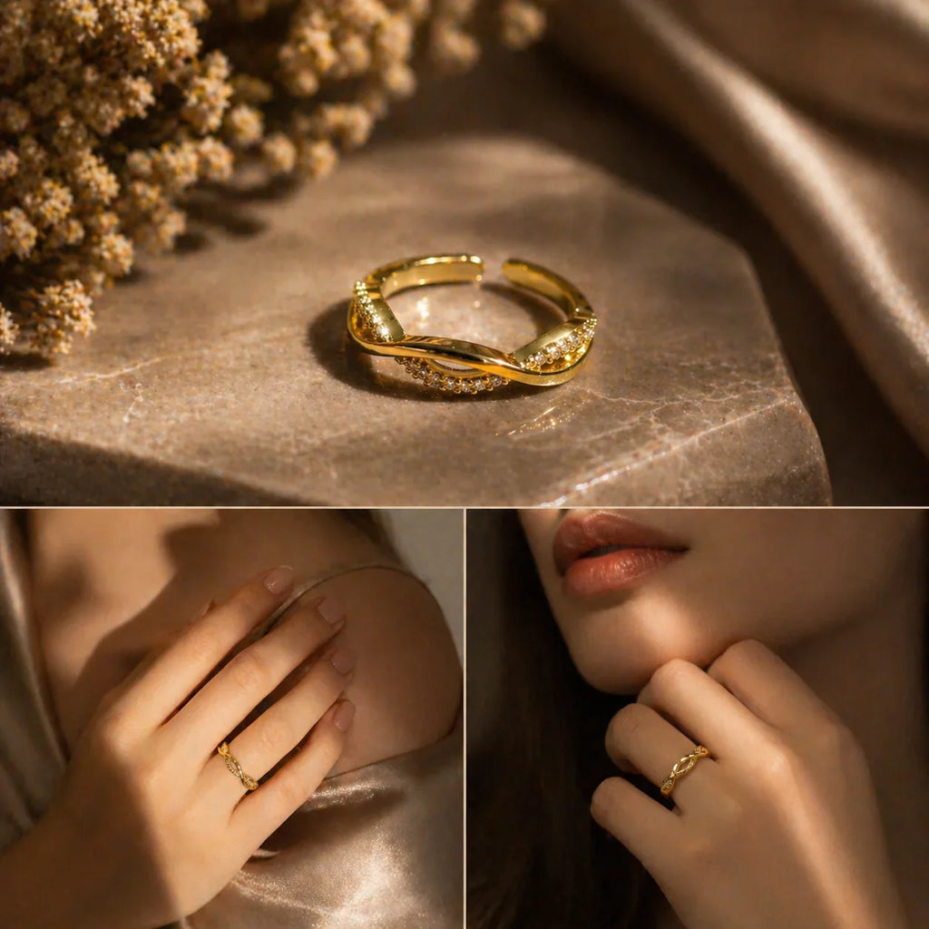 Elegant gold infinity ring with cubic zirconia, styled on hand with soft fabric and dried flowers
