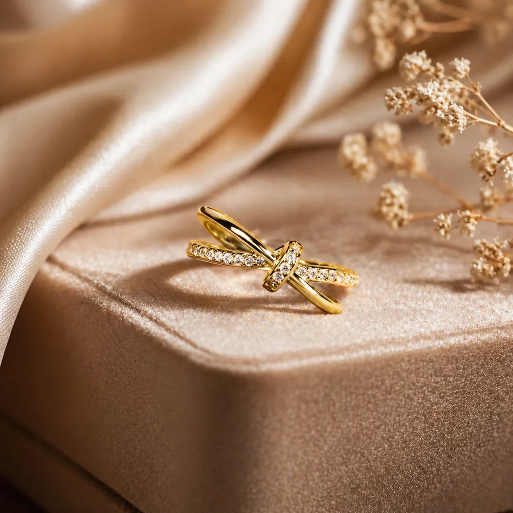 Elegant gold knot ring with sparkling stones, perfect for everyday luxury jewelry for women