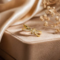 Elegant gold knot ring with sparkling stones, perfect for everyday luxury jewelry for women