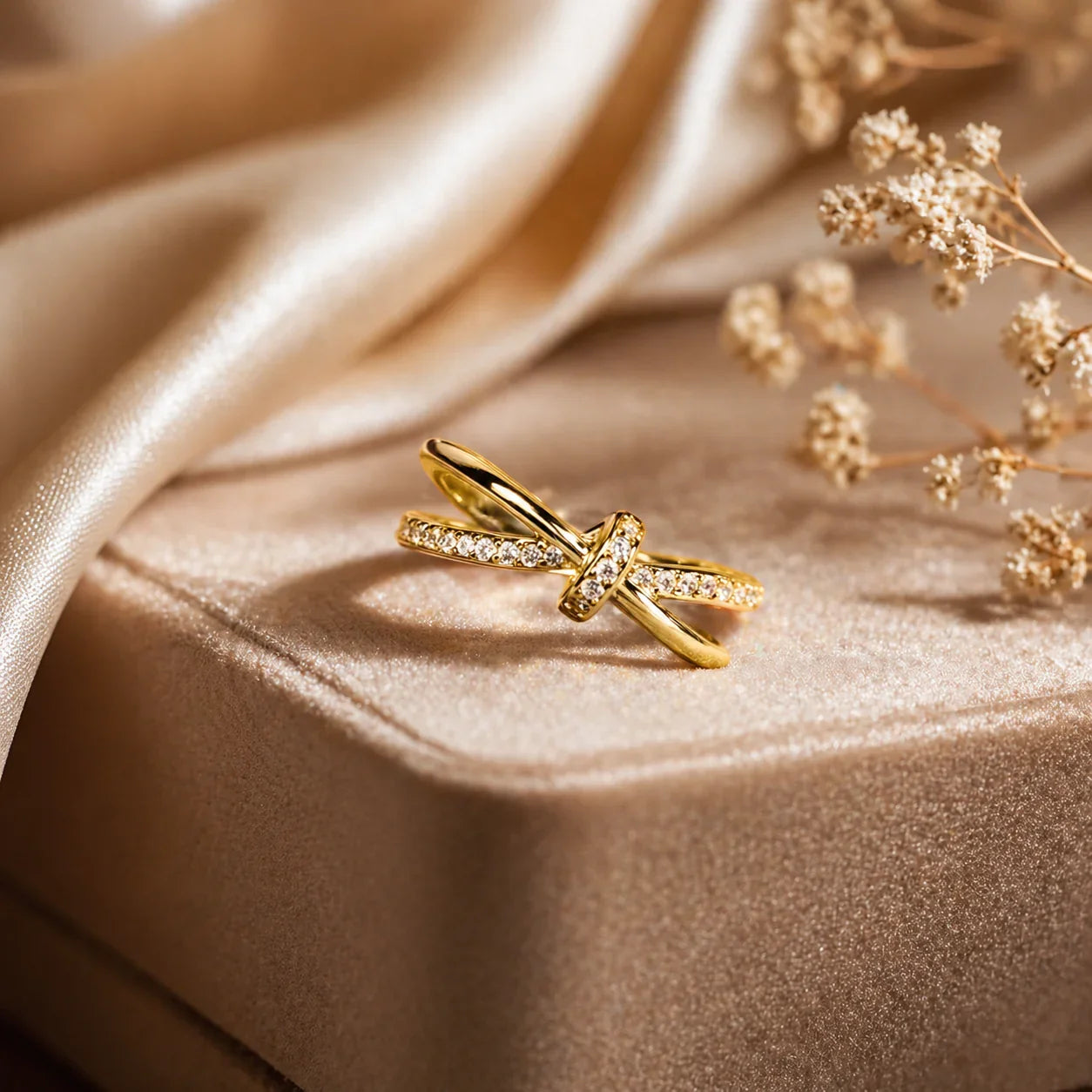 Elegant gold knot ring with sparkling stones, perfect for everyday luxury jewelry for women