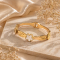 Gold bangle with white clover charm, anti-tarnish jewelry for women, elegant everyday luxury style
