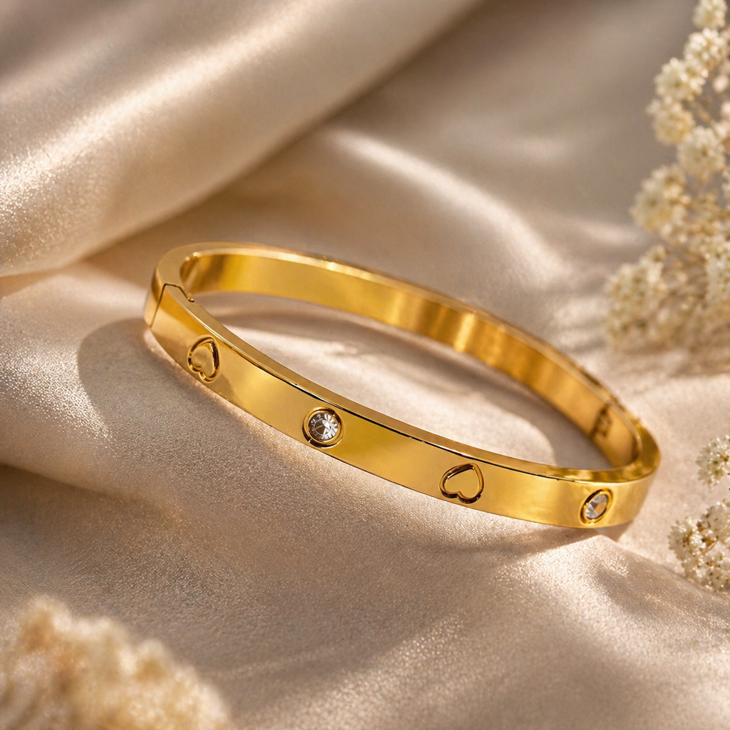 Gold bangle with heart cutouts and clear stones, anti-tarnish luxury jewelry for women