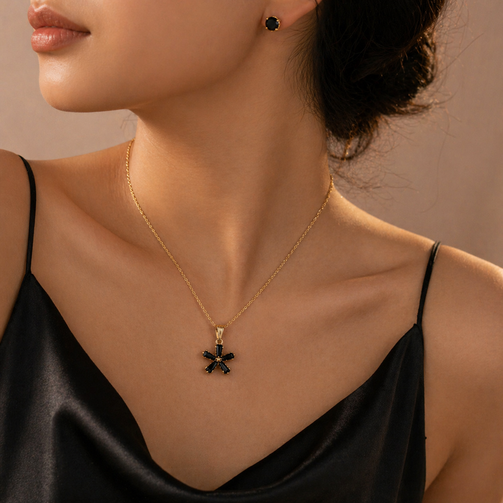 Gold necklace with black star pendant and matching stud earrings, elegant everyday luxury jewelry for women