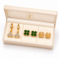 Gold Earrings Combo Set of 3 | Crystal Hoops, Emerald Studs & Clover Studs
