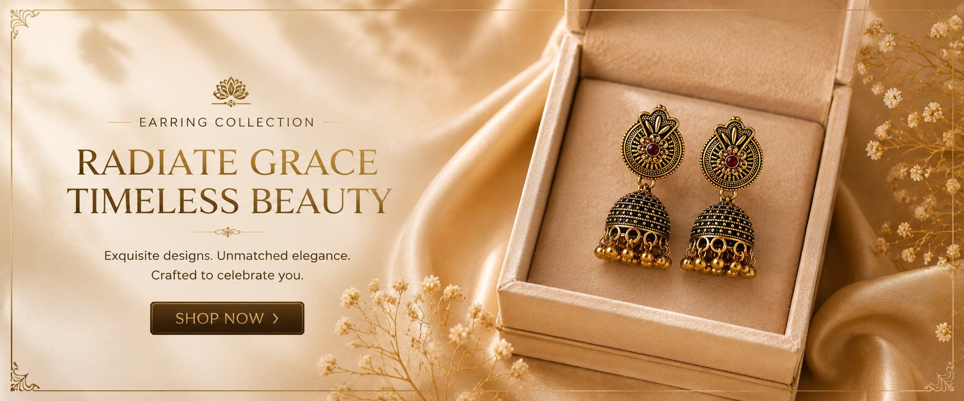 Elegant gold jhumka earrings with red stone, anti-tarnish design, displayed in luxury box on silk
