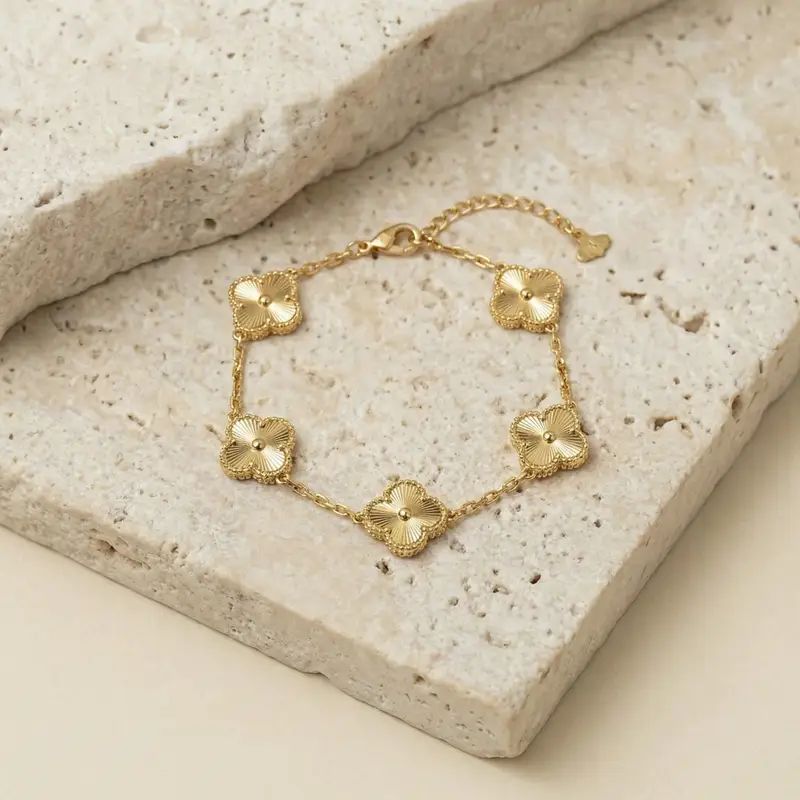 Gold flower charm bracelet with anti-tarnish finish, elegant everyday luxury jewelry for women